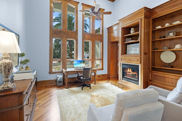 office area featuring light wood-type flooring and ceiling fan