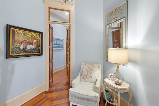 sitting room with hardwood / wood-style flooring