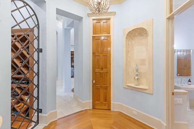 wine cellar with sink and a notable chandelier