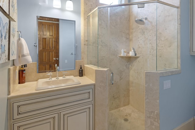 bathroom featuring an enclosed shower and vanity