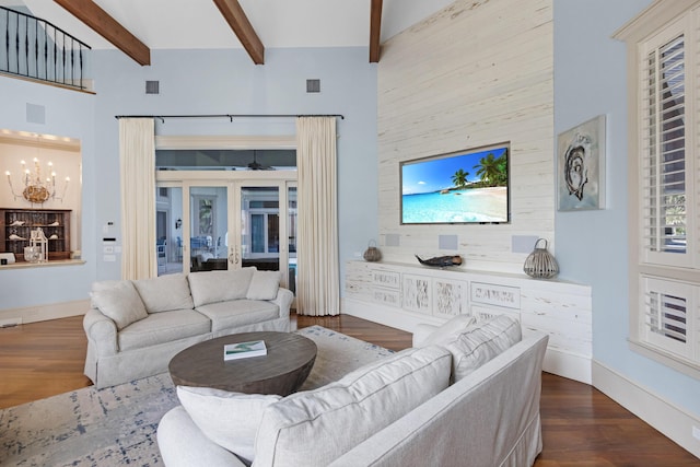 living room with high vaulted ceiling, french doors, and beamed ceiling