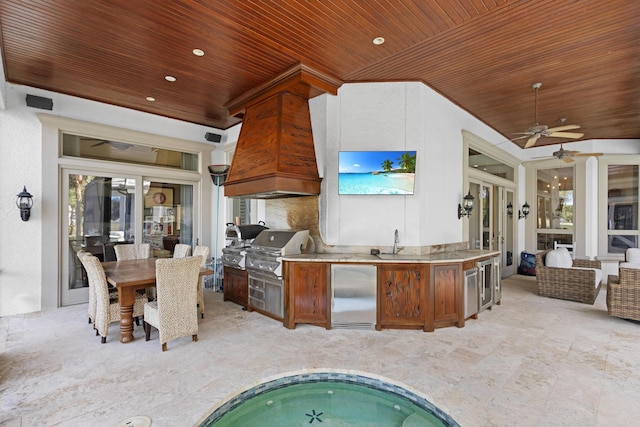 kitchen featuring ceiling fan, vaulted ceiling, sink, stainless steel built in fridge, and wood ceiling