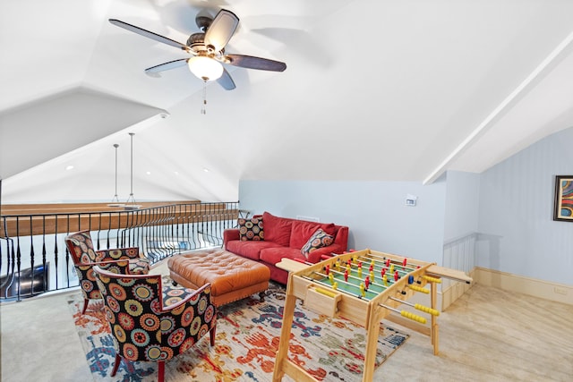 carpeted living room featuring vaulted ceiling and ceiling fan