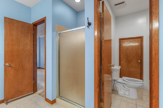 bathroom with toilet and walk in shower