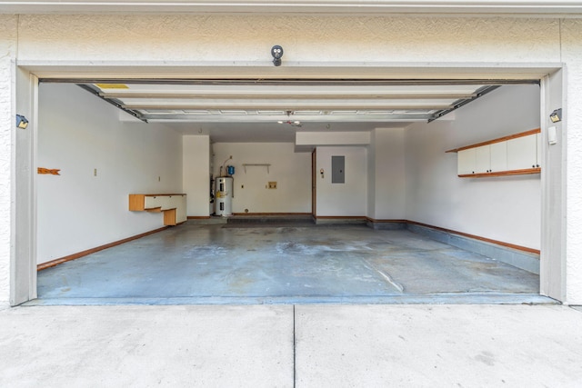 garage featuring electric panel and electric water heater