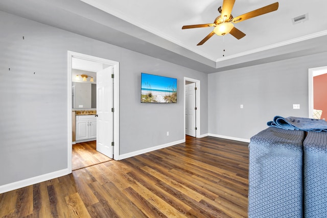 interior space featuring baseboards, visible vents, dark wood finished floors, and a ceiling fan