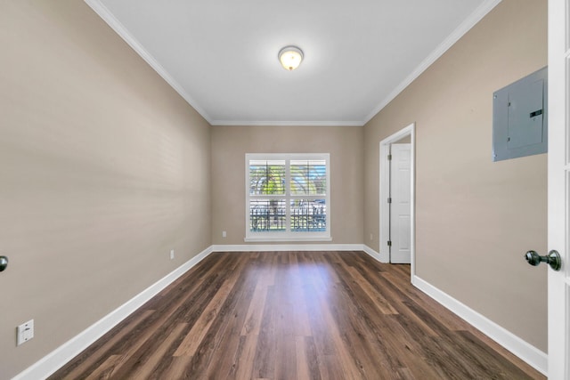 unfurnished room featuring crown molding, dark wood-type flooring, electric panel, and baseboards