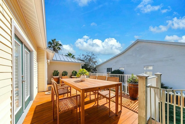 wooden deck with outdoor dining space