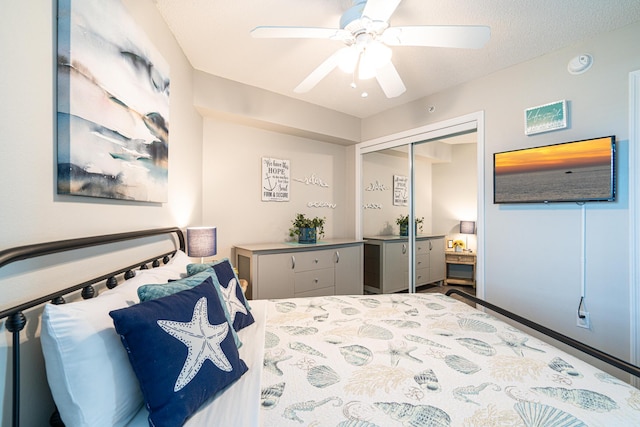 bedroom with a textured ceiling, a closet, and ceiling fan