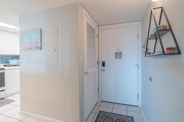 doorway to outside featuring light tile patterned floors