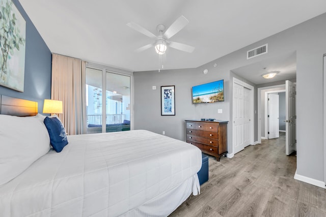 bedroom featuring access to outside, a closet, ceiling fan, and light hardwood / wood-style flooring