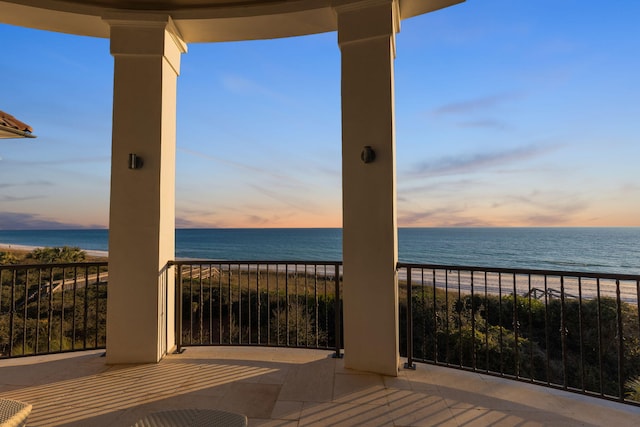 exterior space featuring a view of the beach and a water view