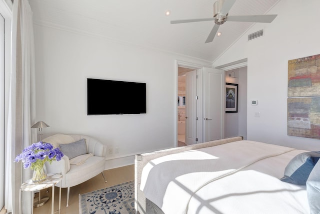 bedroom with ceiling fan, hardwood / wood-style floors, and lofted ceiling