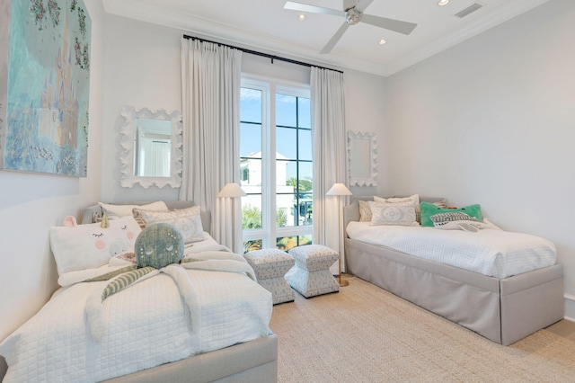 bedroom with ceiling fan and ornamental molding