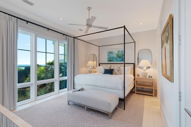 tiled bedroom with ceiling fan and ornamental molding