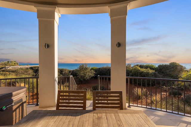 deck at dusk with a water view