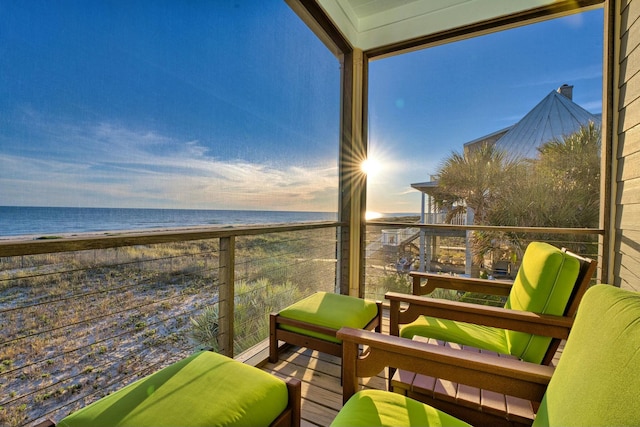 balcony with a view of the beach and a water view