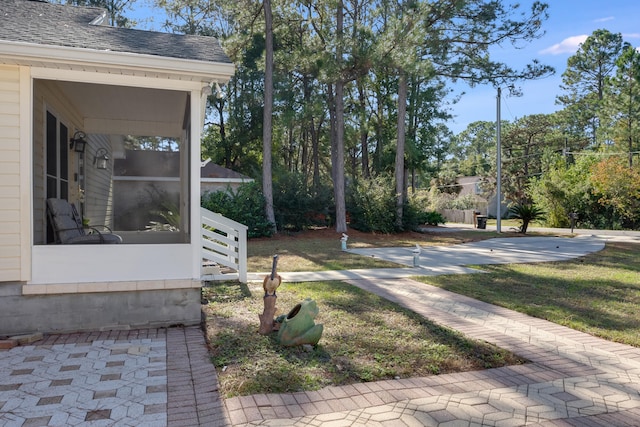 view of yard with a sunroom