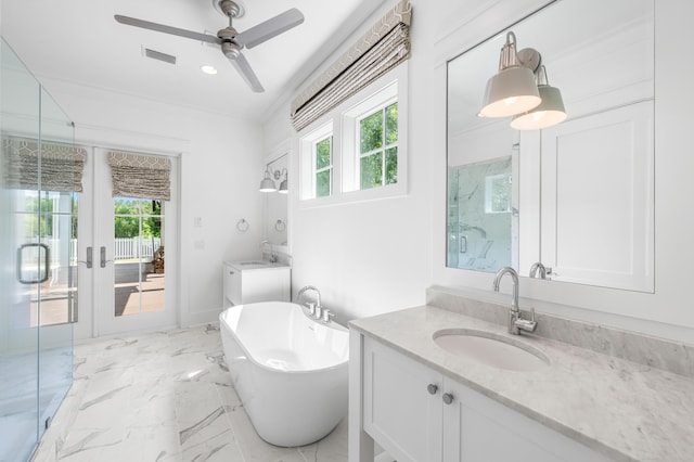 bathroom with vanity, a wealth of natural light, ceiling fan, and plus walk in shower