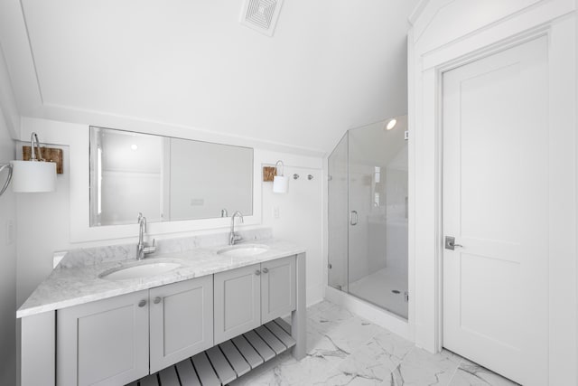 bathroom with vanity and a shower with shower door