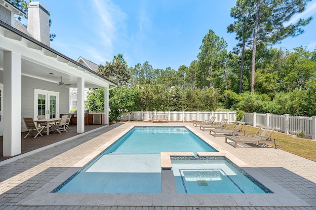 view of pool with a patio area, ceiling fan, and an in ground hot tub