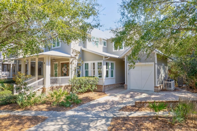 view of front facade with covered porch and a garage