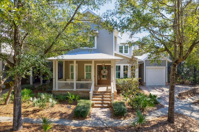 view of front facade featuring a porch and a garage