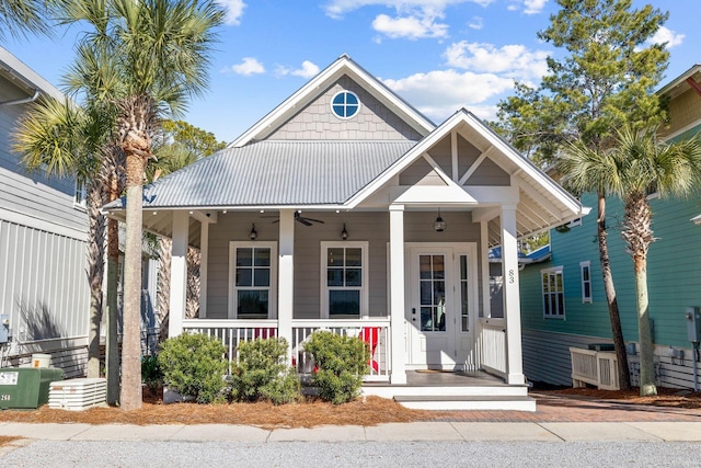 view of front of home featuring ceiling fan and a porch