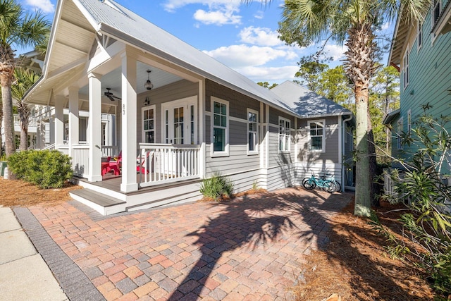 exterior space with covered porch and ceiling fan