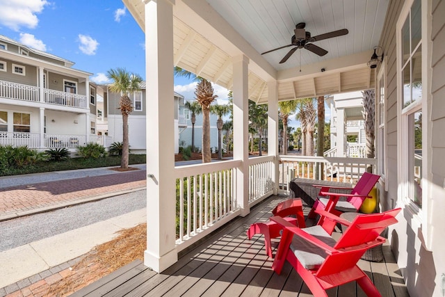 sunroom featuring ceiling fan