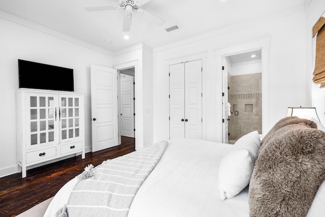 bedroom with ceiling fan, dark hardwood / wood-style floors, connected bathroom, and a closet