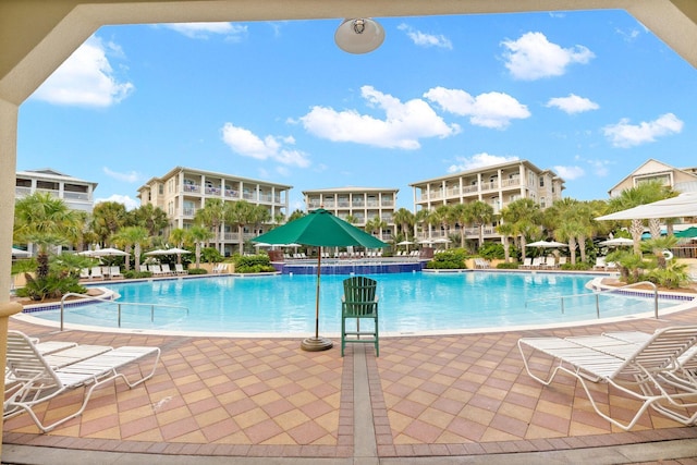 view of swimming pool featuring a patio area