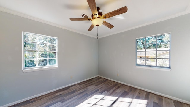 spare room featuring wood-type flooring, ceiling fan, plenty of natural light, and crown molding