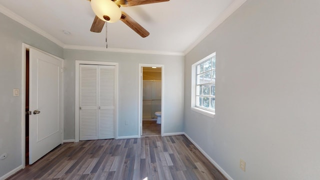 unfurnished bedroom with dark hardwood / wood-style flooring, ceiling fan, ensuite bath, and ornamental molding