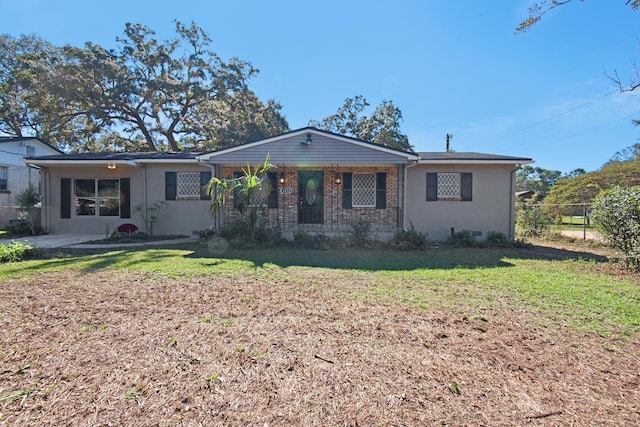 ranch-style home featuring a front yard