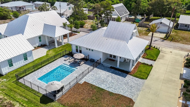 aerial view of residential area featuring a pool