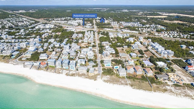 view of property location featuring unending shoreline and nearby suburban area