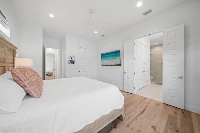 bedroom featuring recessed lighting, light wood-type flooring, ensuite bathroom, ceiling fan, and baseboards