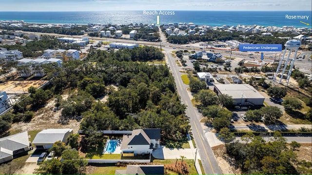 aerial view of property's location featuring a large body of water