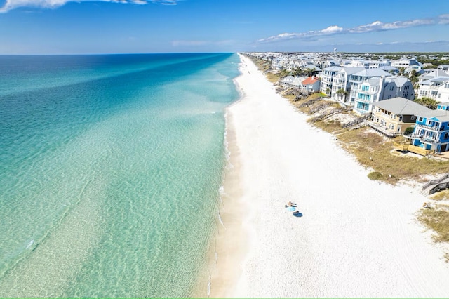 bird's eye view of waterfront with a beach