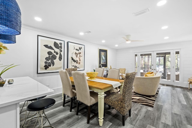 dining room featuring hardwood / wood-style floors and french doors