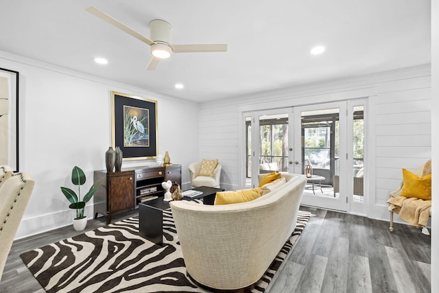 living room featuring ceiling fan, dark hardwood / wood-style flooring, and french doors