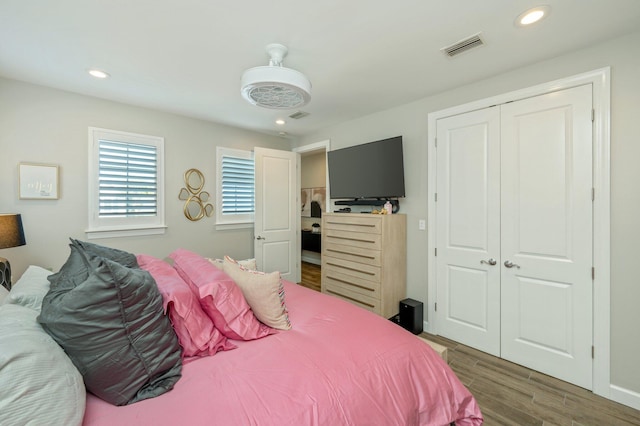 bedroom with dark wood-type flooring