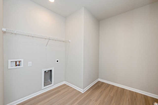 laundry room featuring hookup for a washing machine, electric dryer hookup, and wood-type flooring