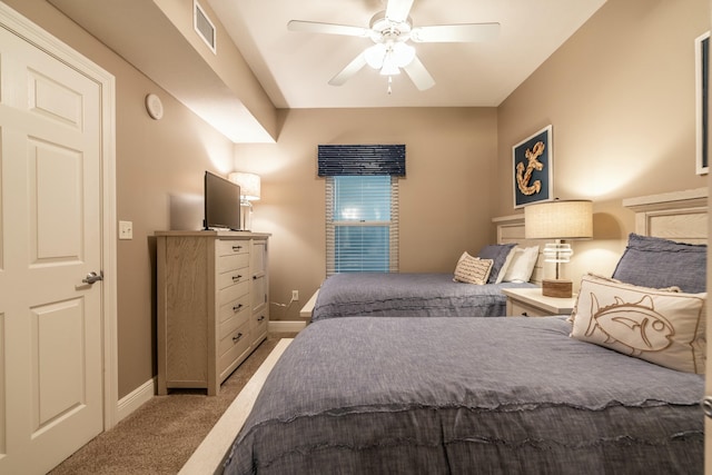 bedroom with light carpet and ceiling fan