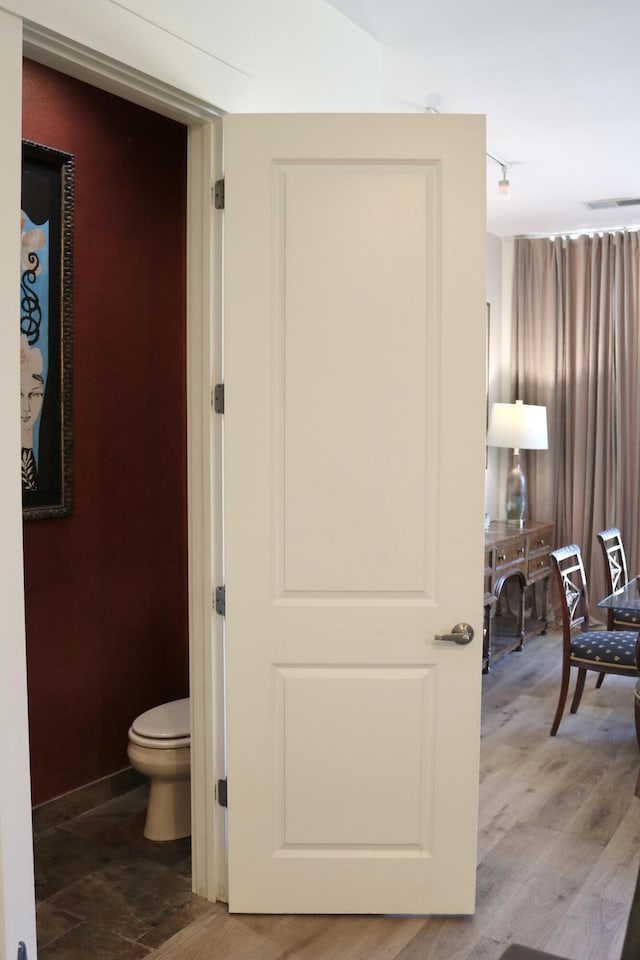 corridor featuring hardwood / wood-style flooring