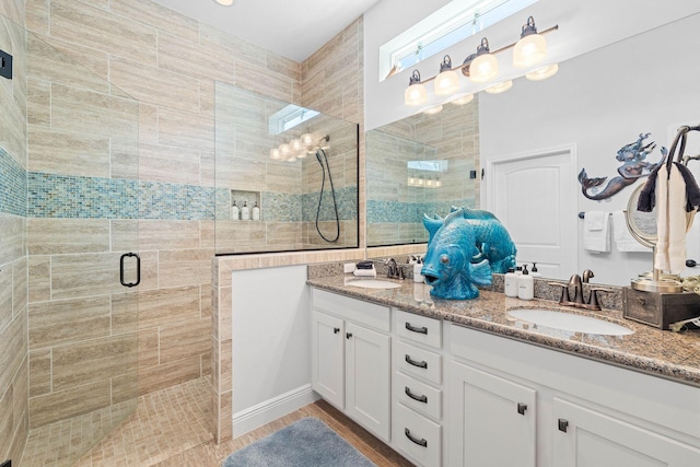 bathroom featuring vanity and an enclosed shower