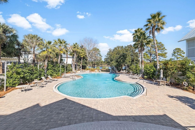 view of pool featuring a patio