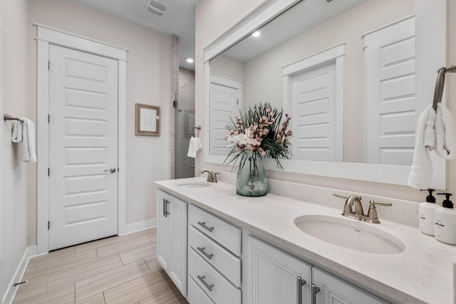 bathroom with vanity and an enclosed shower