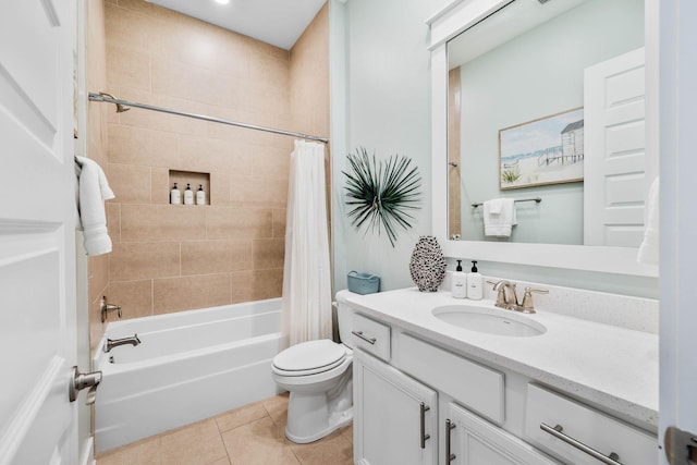 full bathroom with tile patterned flooring, shower / bath combination with curtain, toilet, and vanity